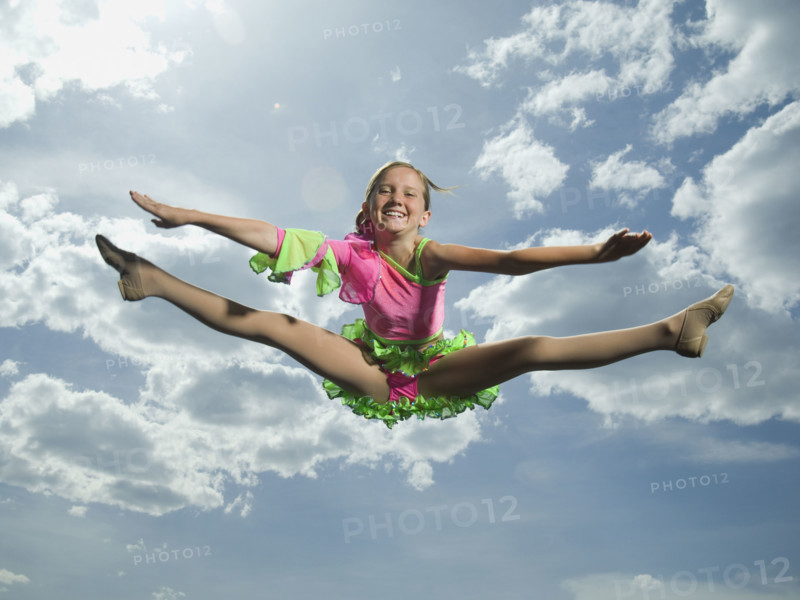 Low angle view of girl jumping. Date : 2007