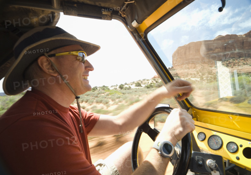Man driving in desert. Date : 2007