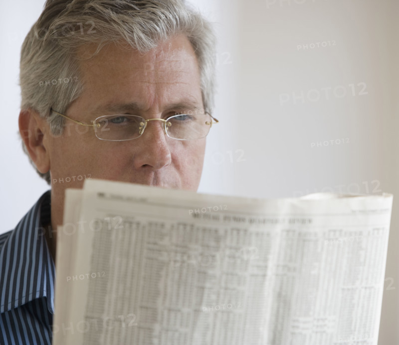 Man reading newspaper.
