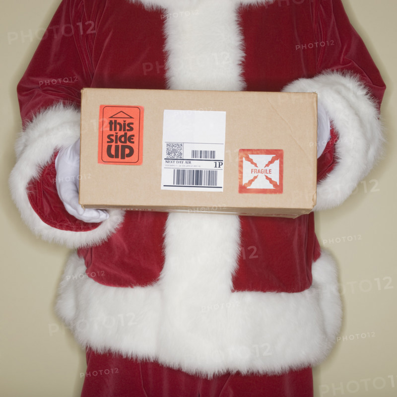 Santa Claus holding package.