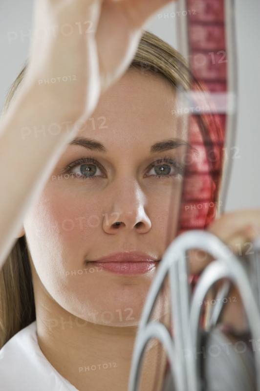 Woman looking at movie film.