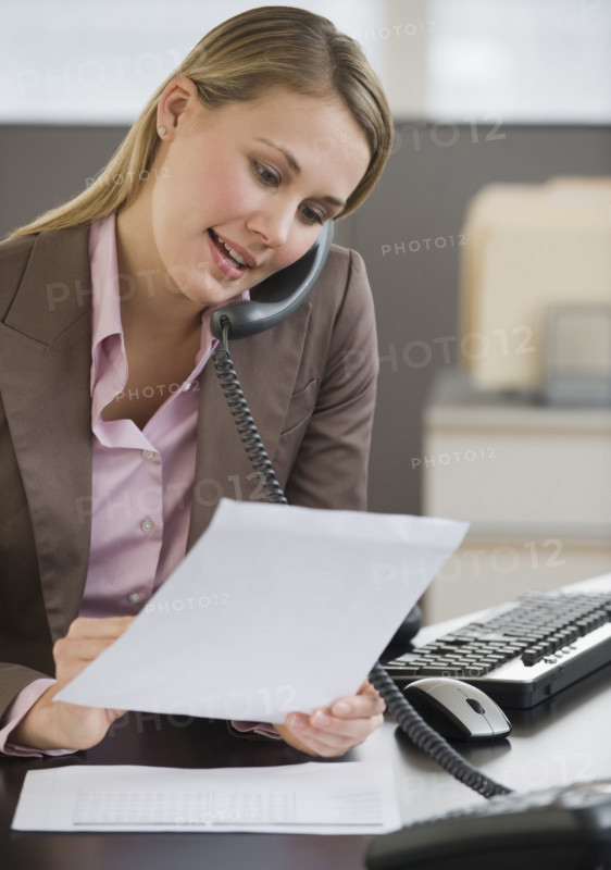Businesswoman talking on telephone.