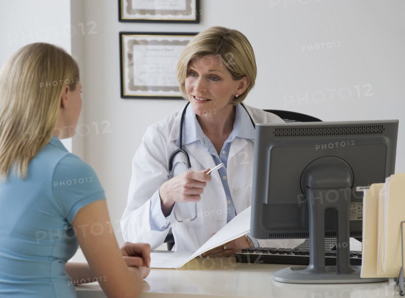 Female doctor talking to patient.
