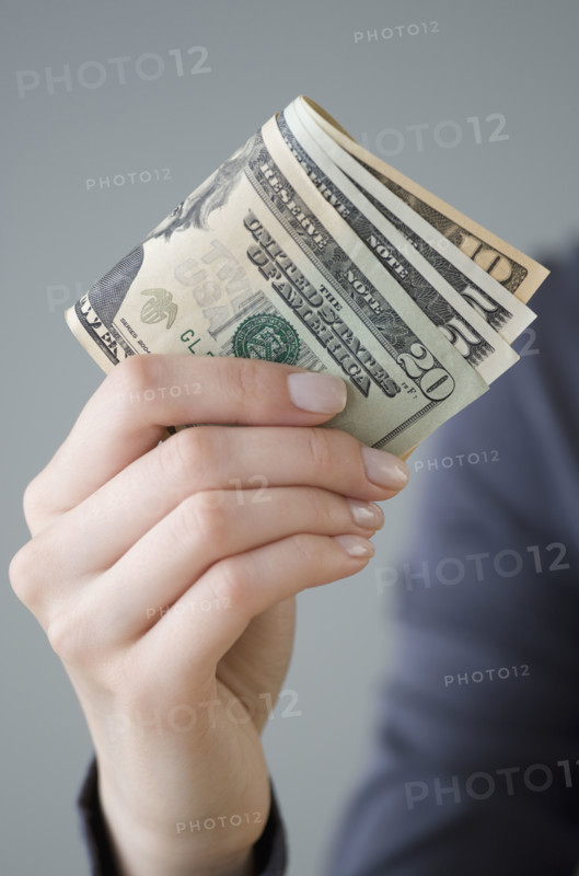 Money in woman’s hand.