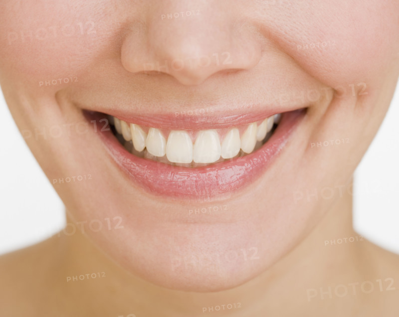 Close up of woman smiling.