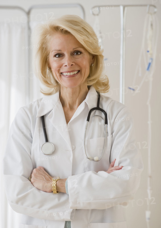 Female doctor with arms crossed.