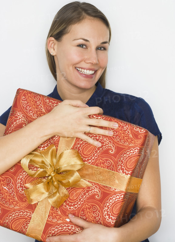 Woman hugging gift.