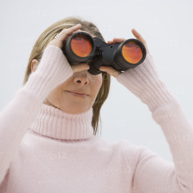 Woman looking through binoculars.