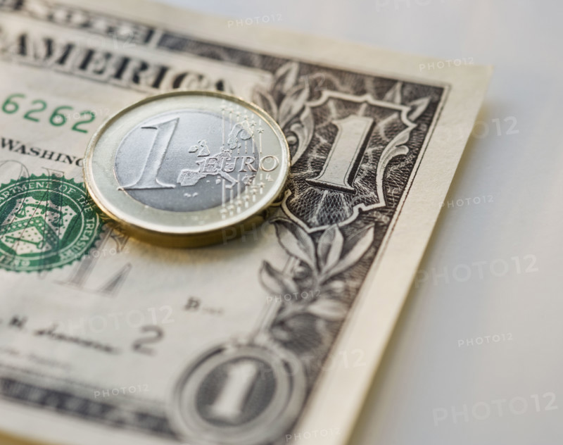 Close up euro coin and us dollar.