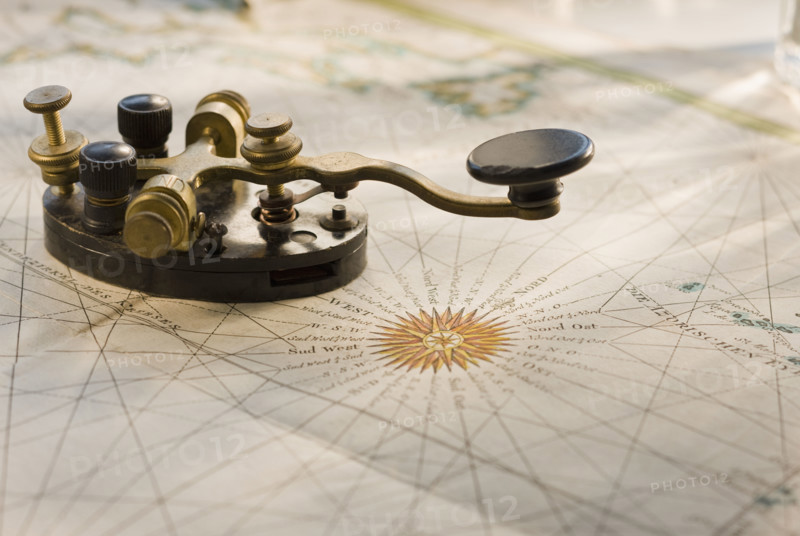 Telegraph key on antique map.