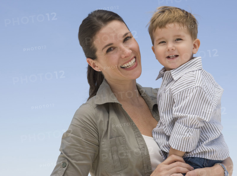 Mother holding son.