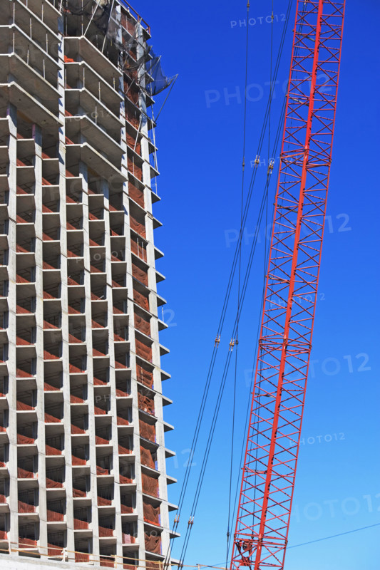 Low angle view of crane and apartment building, New York City, New York, United States. Date : 2008