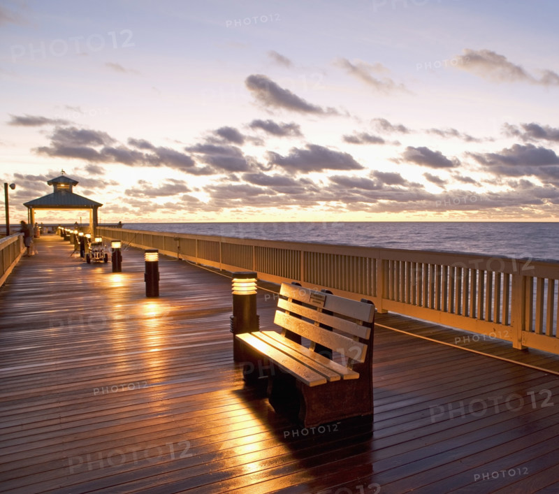 benches on pier during sunrise/sunset. Date : 2008