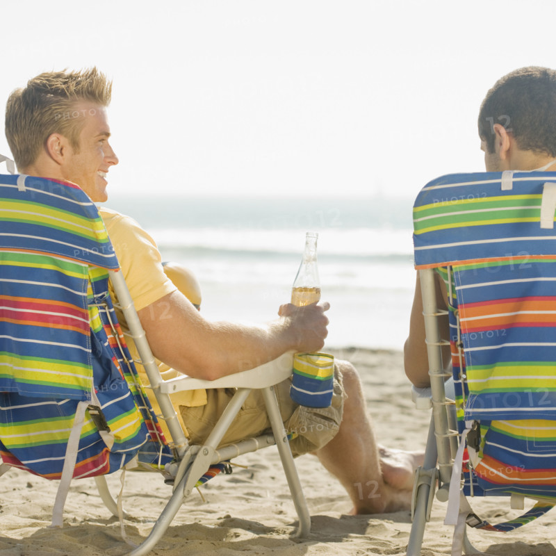 Two men sitting in beach chairs. Date : 2008