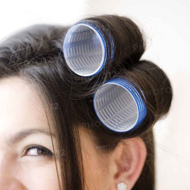 Close up of curlers in woman’s hair. Date : 2008