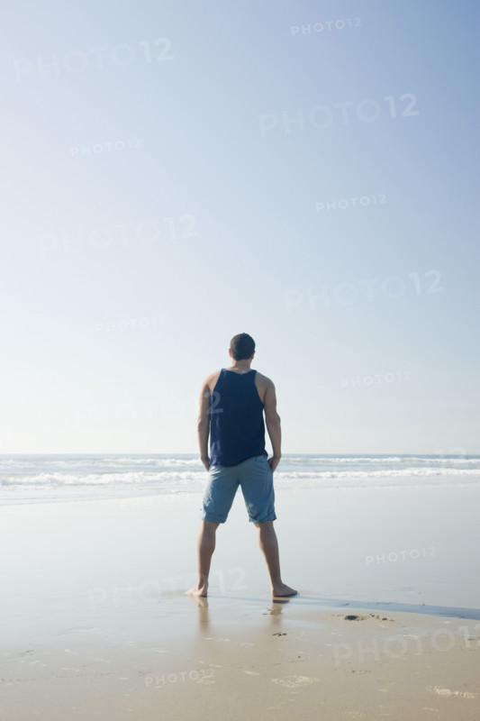 Man standing on beach. Date : 2008