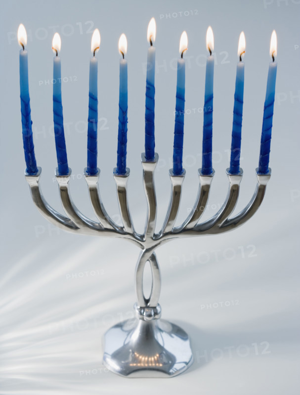 Close up of menorah with lit candles. Date : 2008