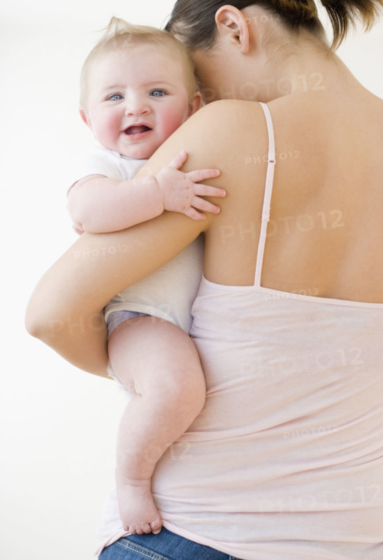 Mother holding baby. Date : 2008