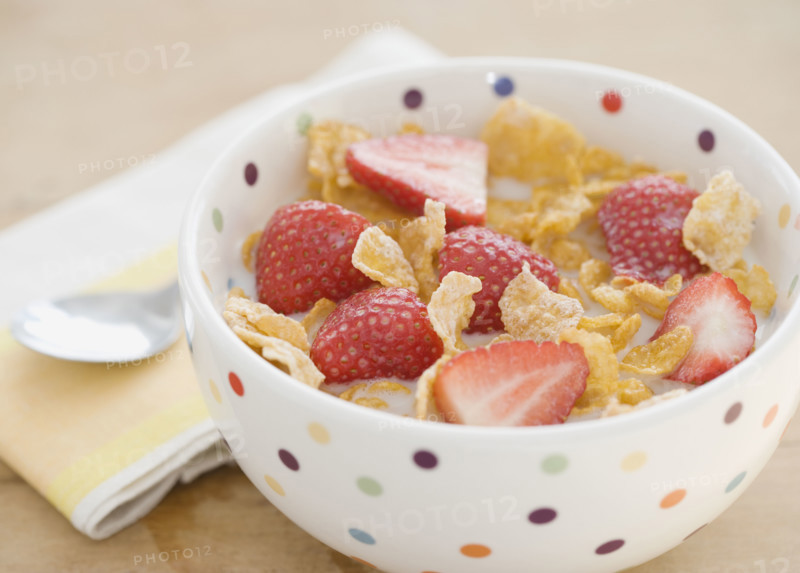 Close up of cereal and strawberries in bowl. Date : 2008
