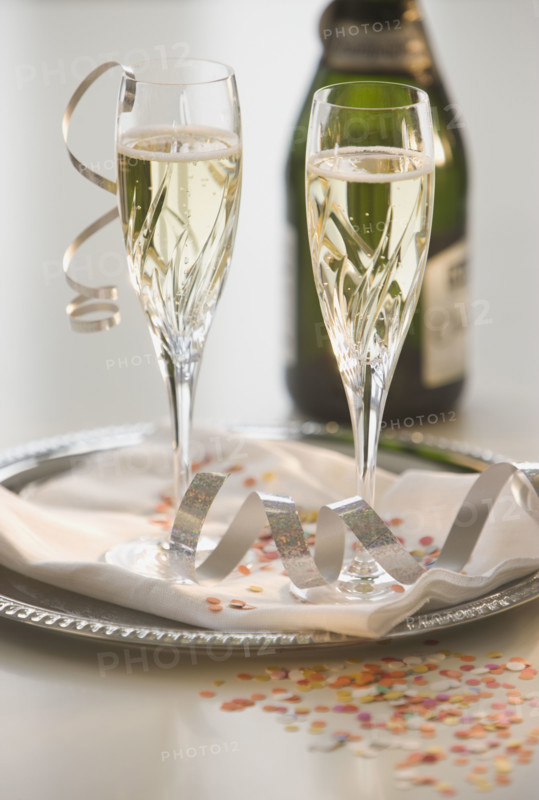Glasses of champagne on tray.