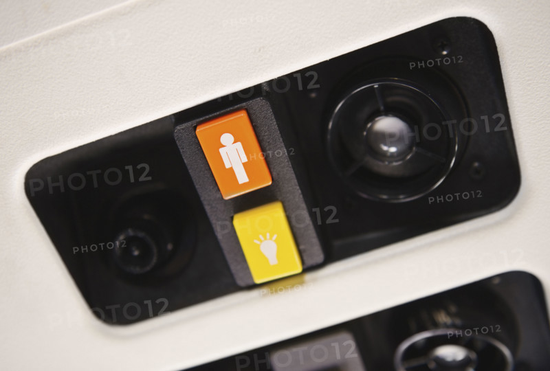 Close up of airplane call button.