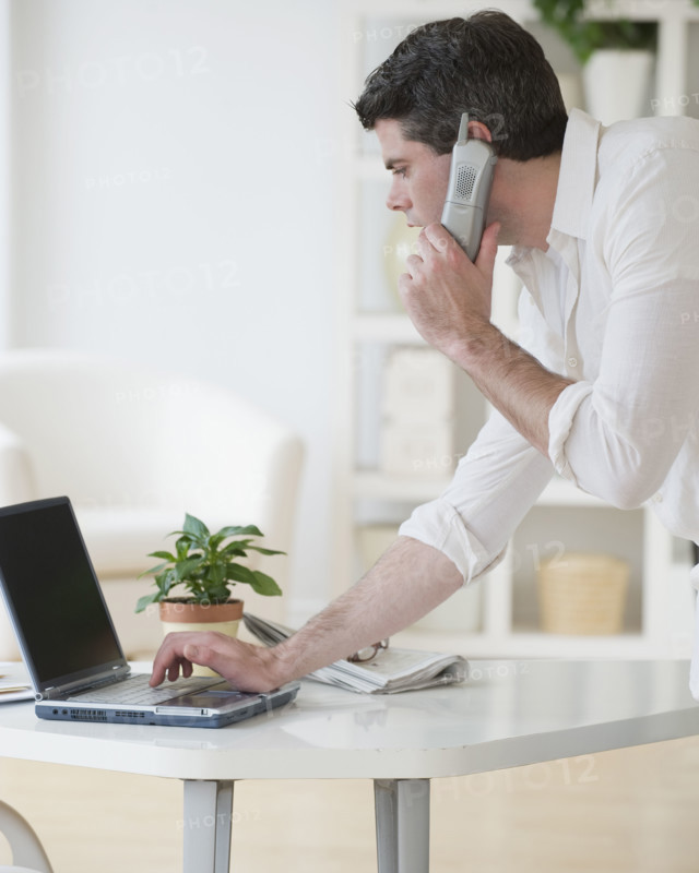 Man talking on telephone.