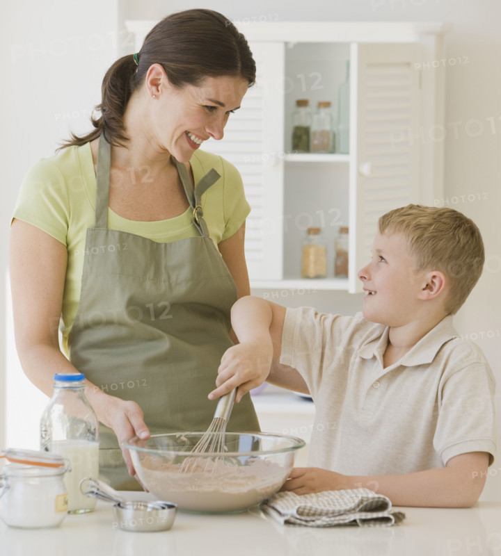 Mother and son making batter.