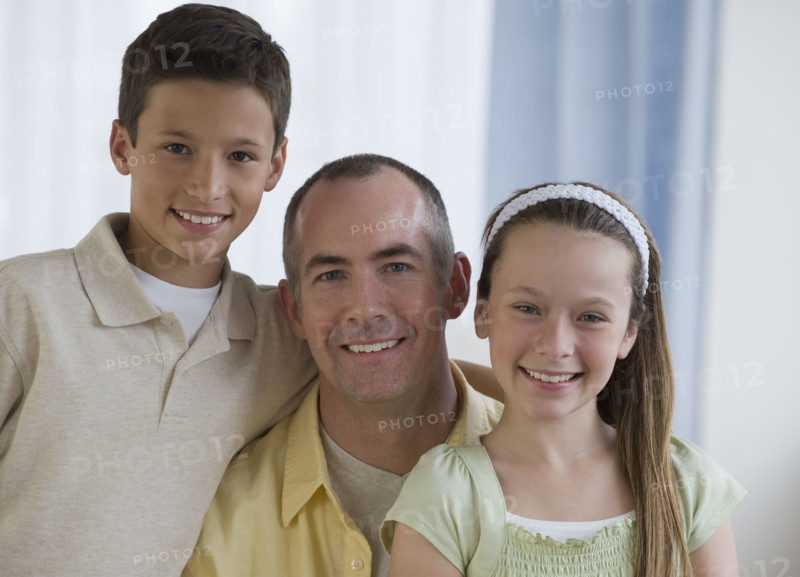 Father and children hugging.