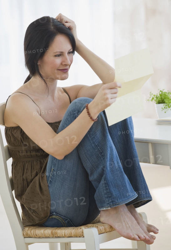 Woman reading letter.