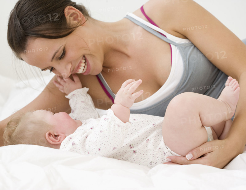 Mother smiling at baby. Date : 2008