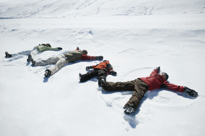 Family making snow angels. Date : 2008