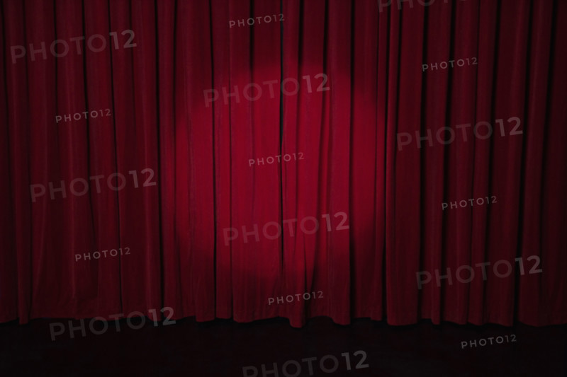 Spotlight on stage curtain. Date : 2008