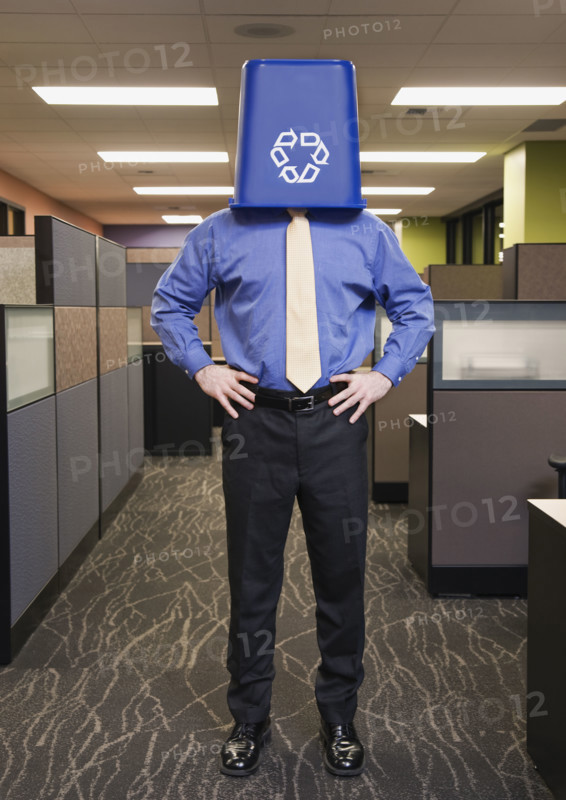 Businessman with recycling bin on head. Date : 2008