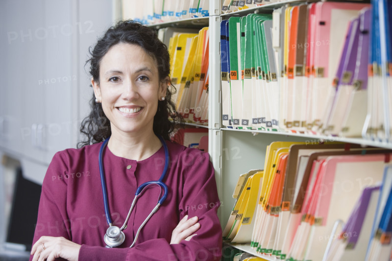 Female doctor next to charts. Date : 2008