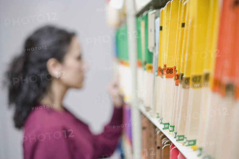 Woman looking at folders. Date : 2008