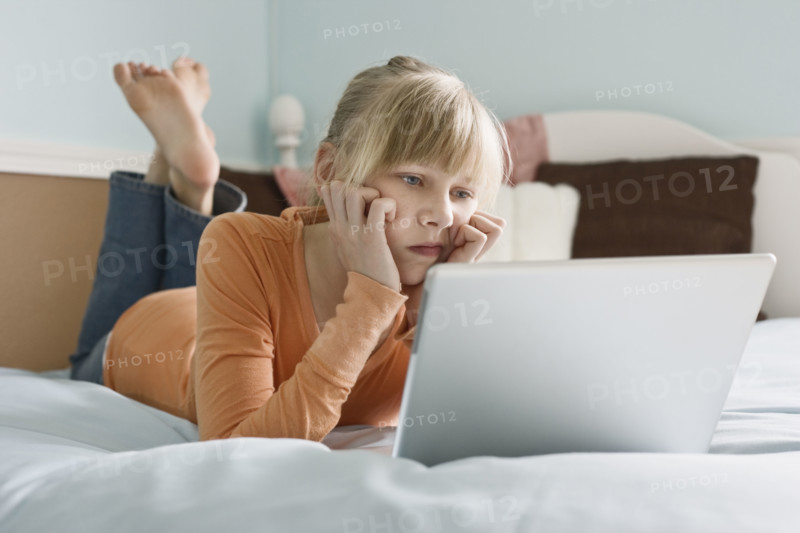 Girl looking at laptop. Date : 2008