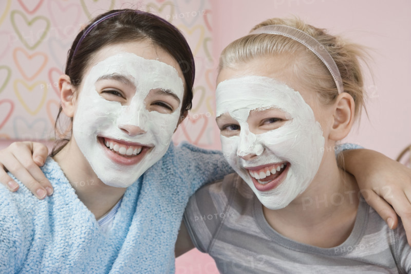 Girls with facial treatment laughing. Date : 2008
