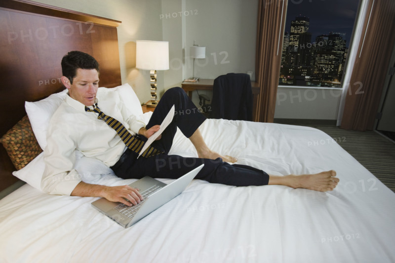 Businessman typing on laptop. Date : 2008