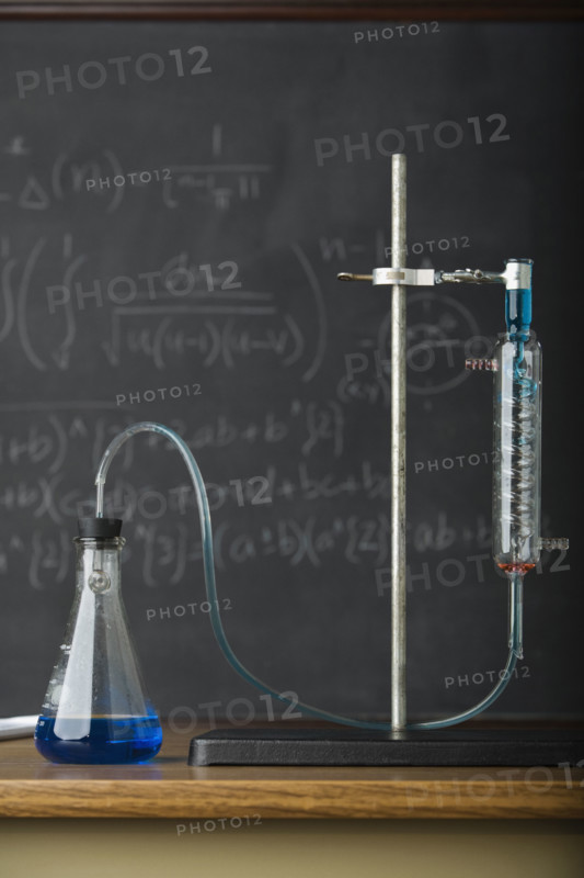 Science experiment in front of blackboard. Date : 2008