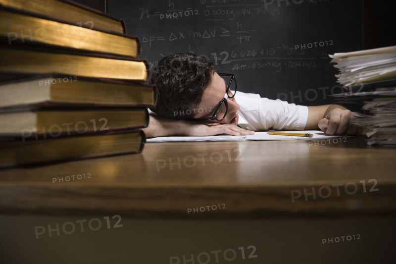 Nerdy man sleeping on school desk. Date : 2008