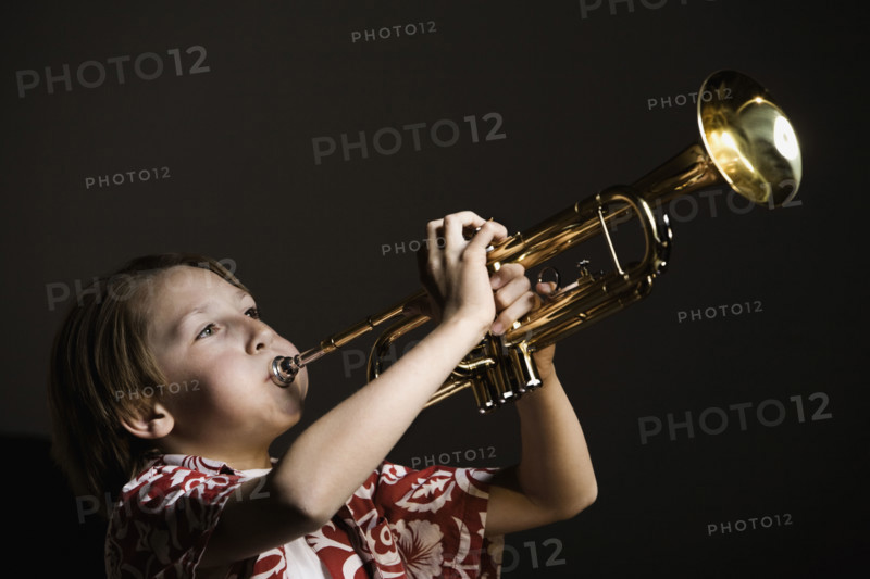Boy playing trumpet. Date : 2008