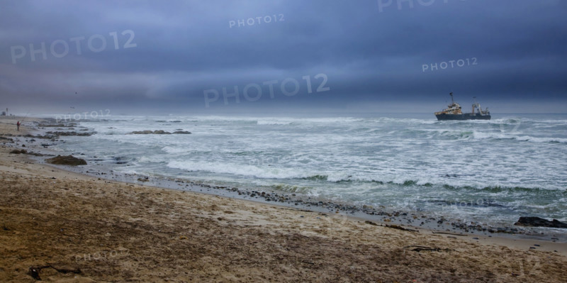 View of ocean and ship in distance, Namibia, Africa. Date : 2008