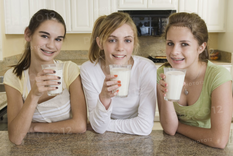Teenaged girls drinking milk. Date : 2008