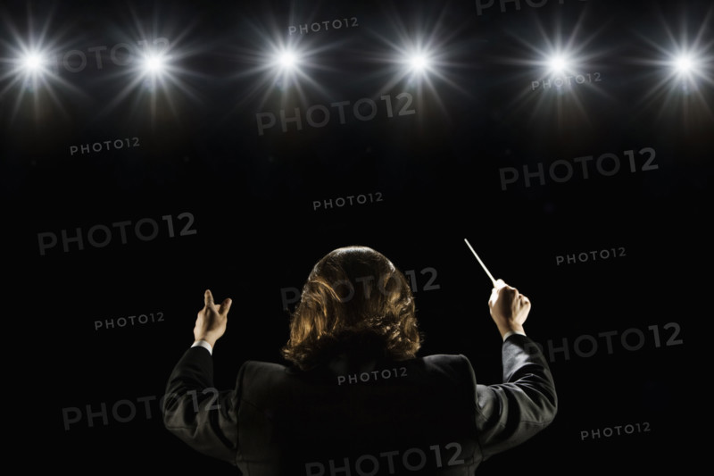 Man conducting under lights. Date : 2008