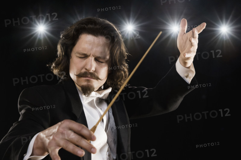 Man conducting under lights. Date : 2008