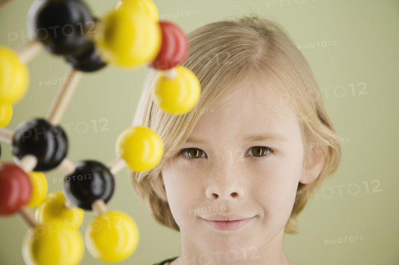 Boy next to molecular model. Date : 2008