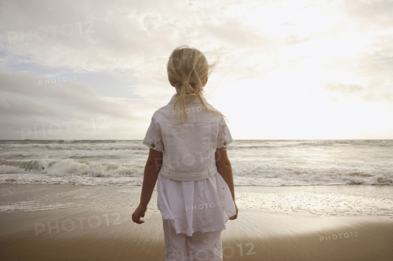 Girl looking out at ocean. Date : 2008