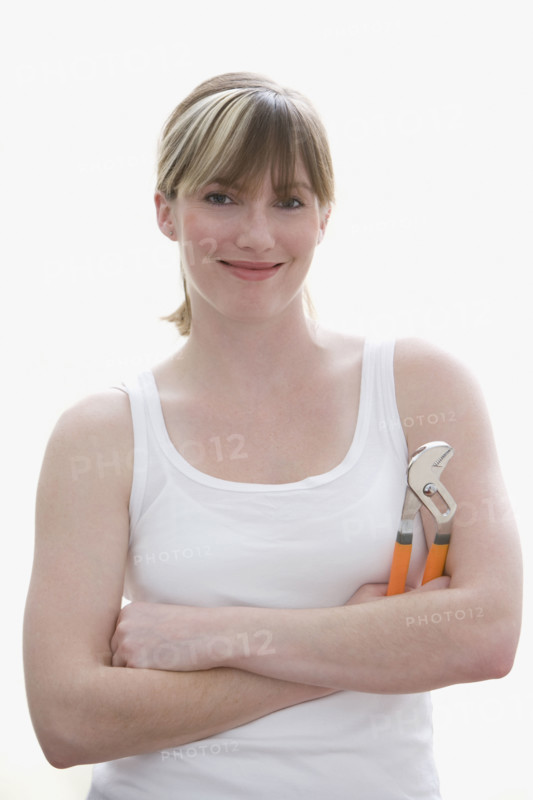 Woman holding wrench. Date : 2008