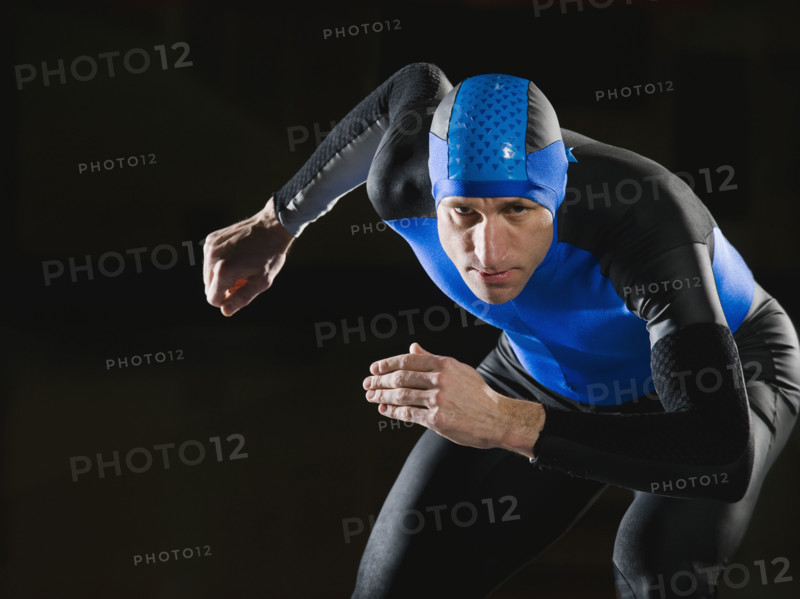 Male speed skater in ready position. Date : 2008