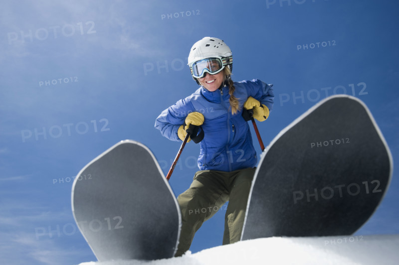 Low angle view of woman on skis. Date : 2008
